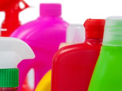 Various detergent containers arranged on white background