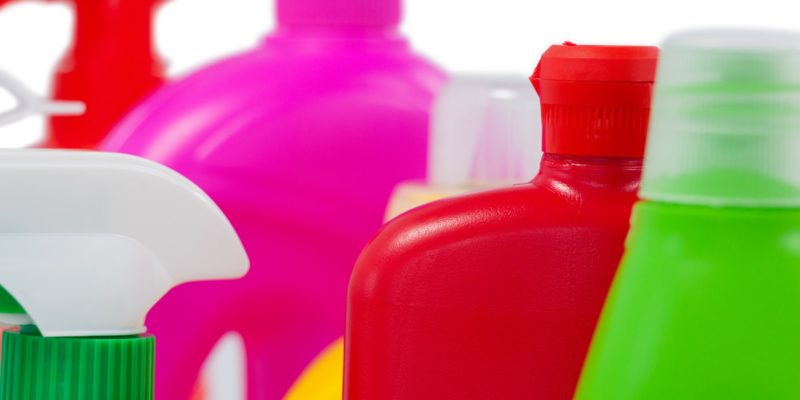 Various detergent containers arranged on white background