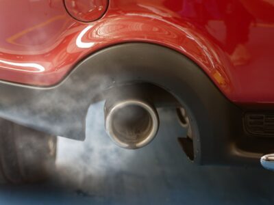 Car smog and air pollution from the exhaust pipe.